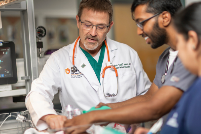 doctor instructing students on procedure