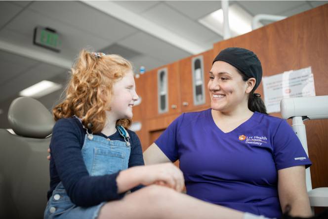 Dental assistant with child