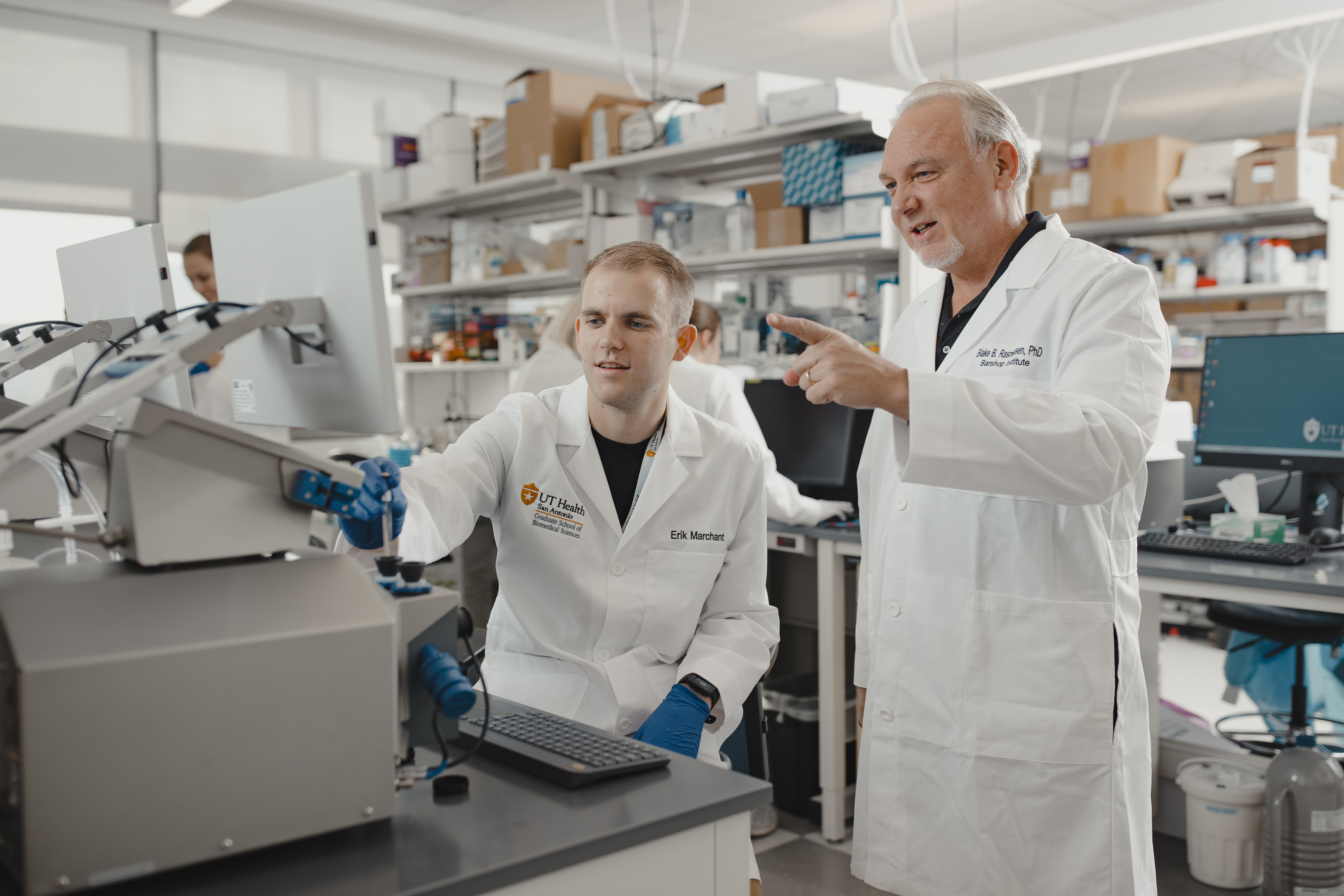 Student Erik Marchant in lab with Professor Rasmussen, PhD