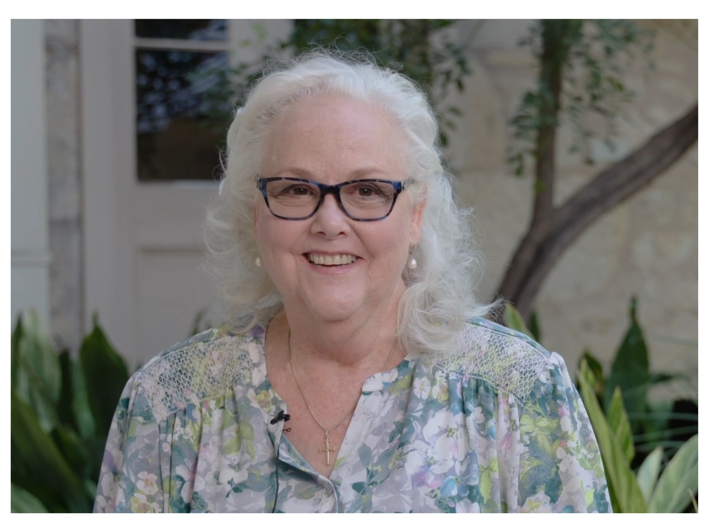Suzanne Castle smiling during a video interview 