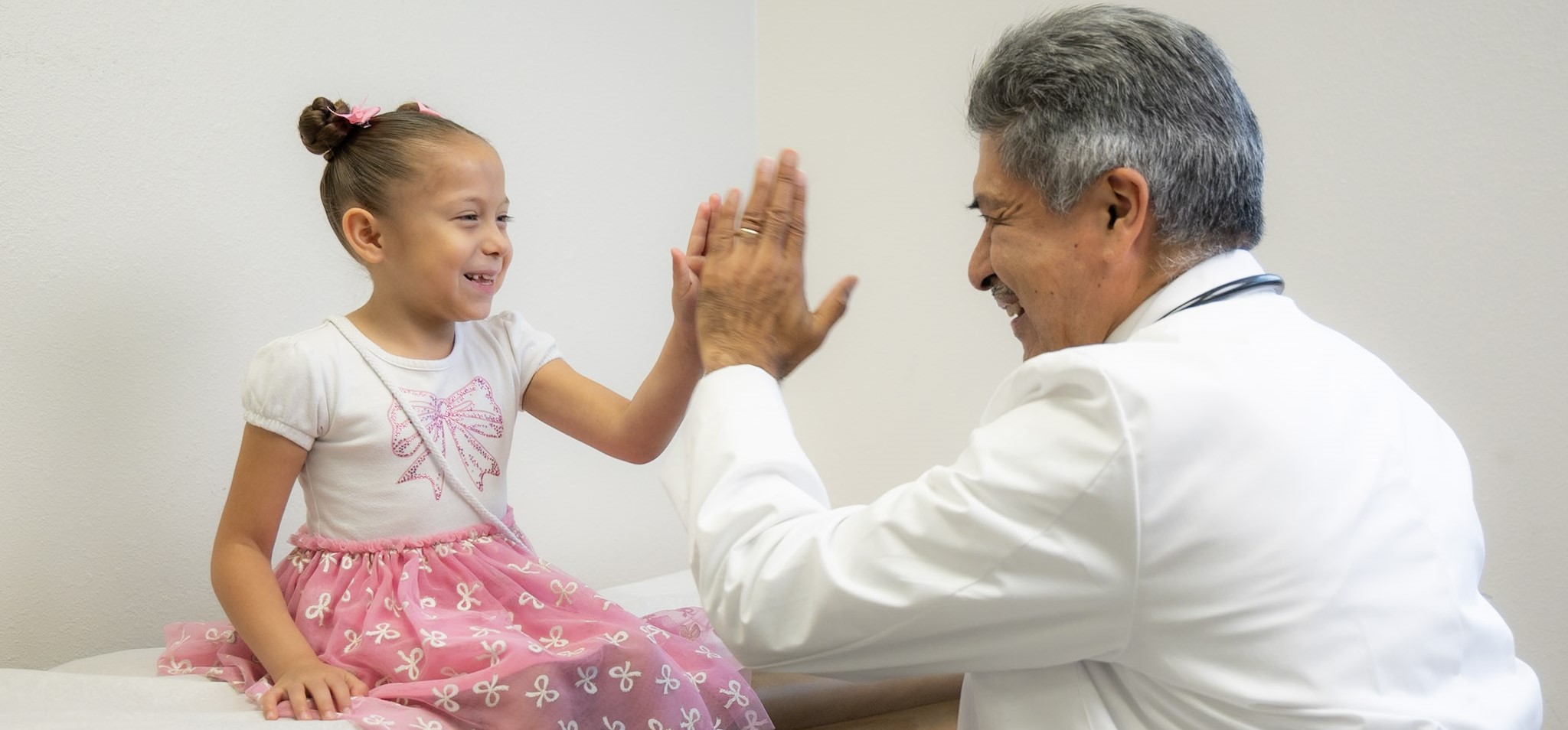Doctor and child high five