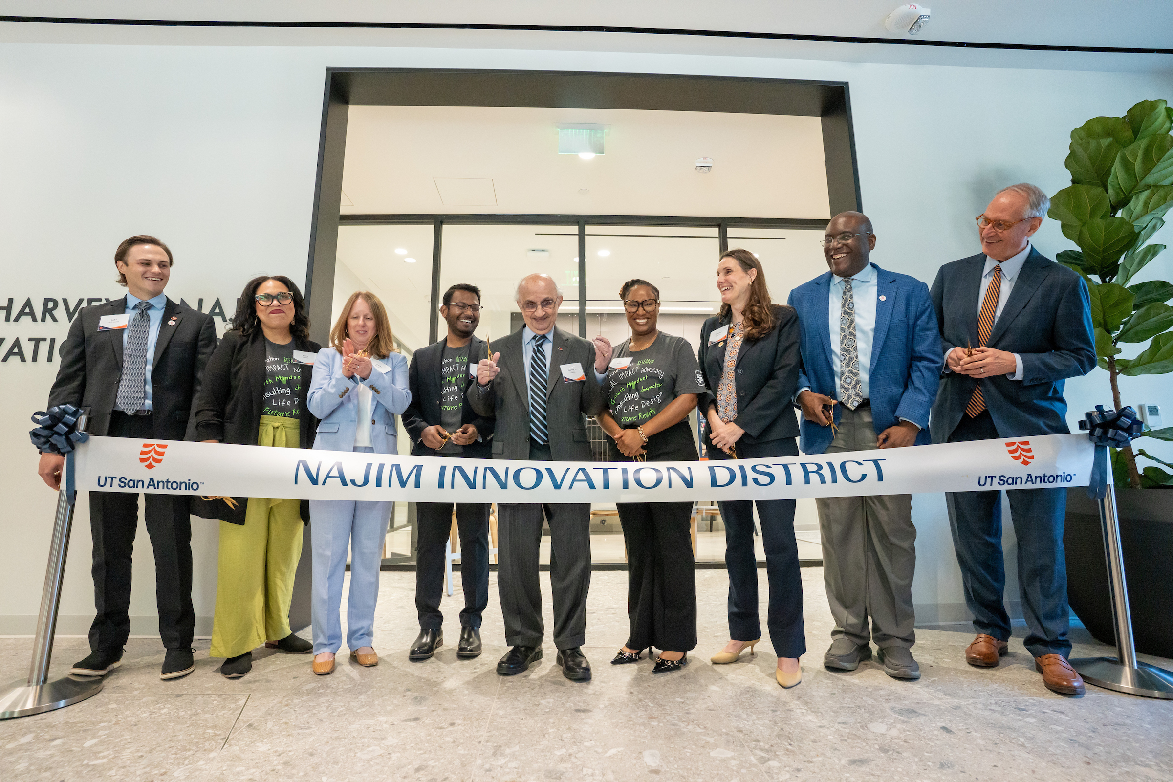 Community leaders celebrate the opening of the Najim Innovation District. 