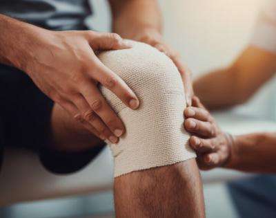 Photo of a knee wrapped in gauze 