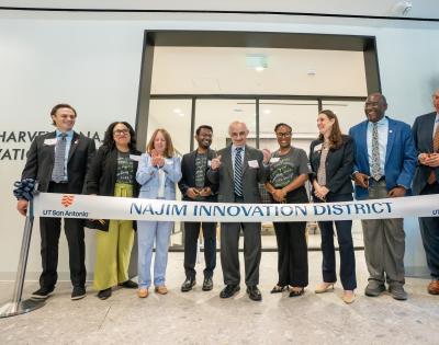 Community leaders celebrate the opening of the Najim Innovation District. 